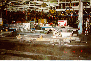 factory6.gif - Floor pan sheet metal mounted on line car