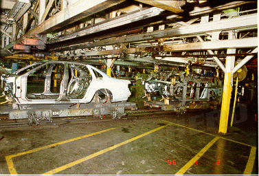 factory9.gif - Body shell, weaving its way through the body shop