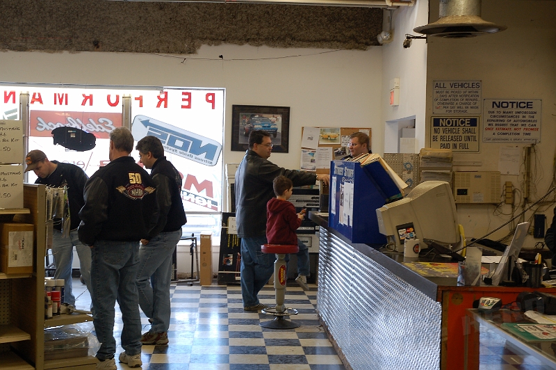 DSC_0722.JPG - A lengthy study of the shelf items. Boy! ... the mods. add up quick!... and who's that at the counter? It's HERD Founder, John Kelly and son.