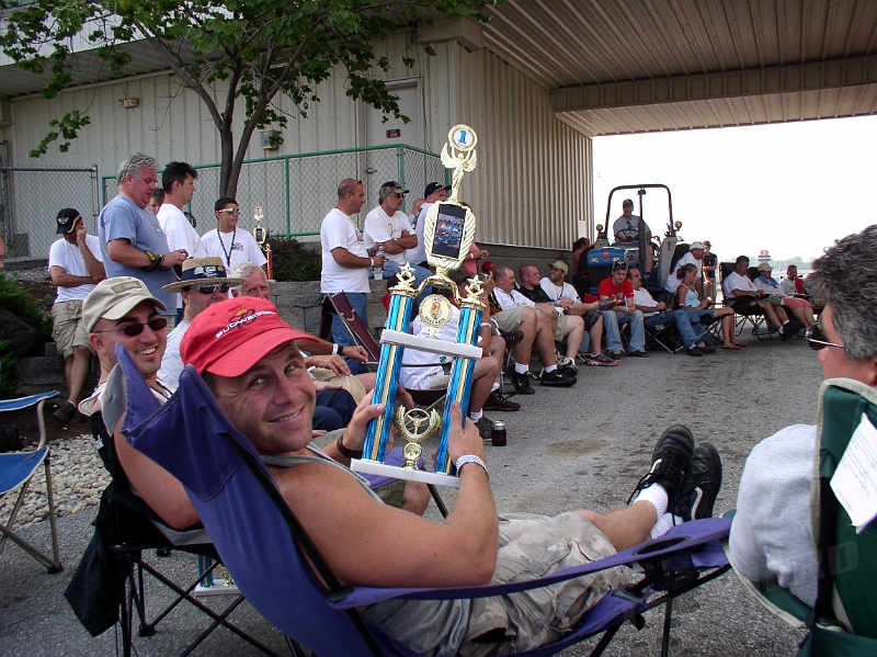 P1010070.JPG - Brad relaxing with his 1st Place for quickest reaction time.